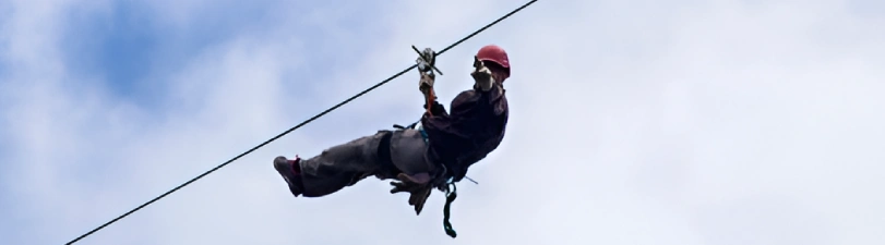 Technician inspecting a rescue tripod for safety compliance